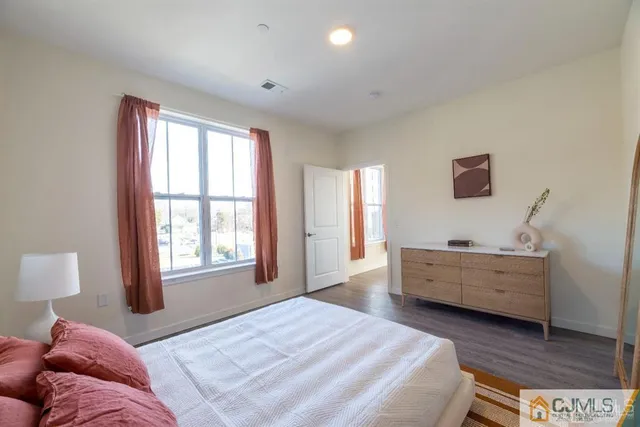 a bathroom with a tub sink and a mirror