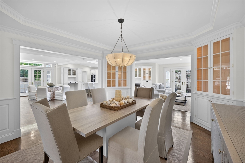 1114 Orleans Road, Unit 1 North Chatham, MA 02650 - Photo 23 of 42 a dining room with furniture a chandelier and wooden floor