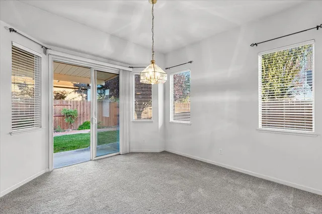 a view of a room with windows and entryway