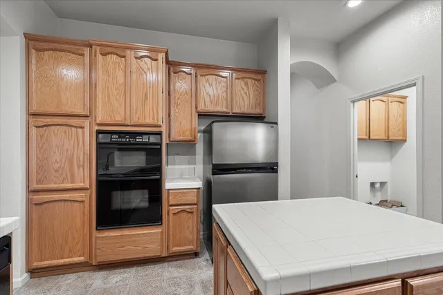 a kitchen with a refrigerator and a stove