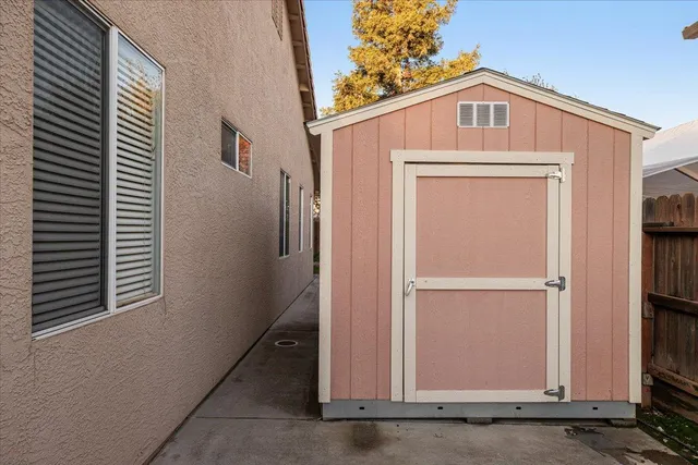 a front view of a house with a wooden fence