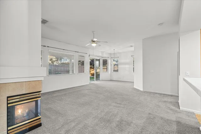 a view of an empty room with a fireplace