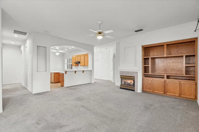 a view of a kitchen with a sink and a fireplace