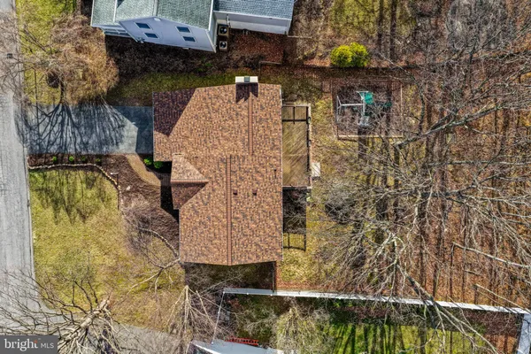 a aerial view of a house with a yard
