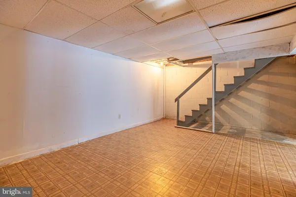 a view of an empty room with stairs