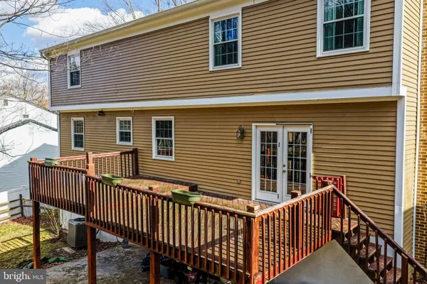 a view of a house with wooden deck