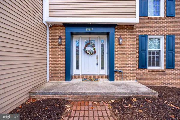 a view of a brick house with a door and a window