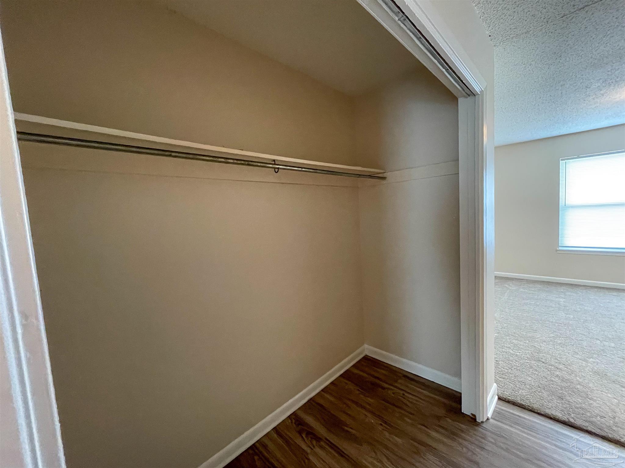 3226 Santa Rosa Drive Gulf Breeze, FL 32563 - Photo 7 of 11 a view of a room with wooden floor and small window