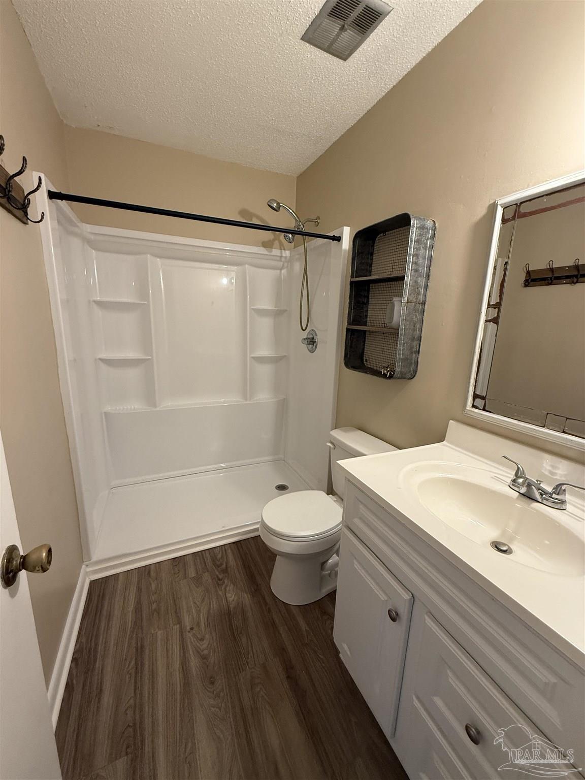 3226 Santa Rosa Drive Gulf Breeze, FL 32563 - Photo 9 of 15 a bathroom with a sink a toilet and shower