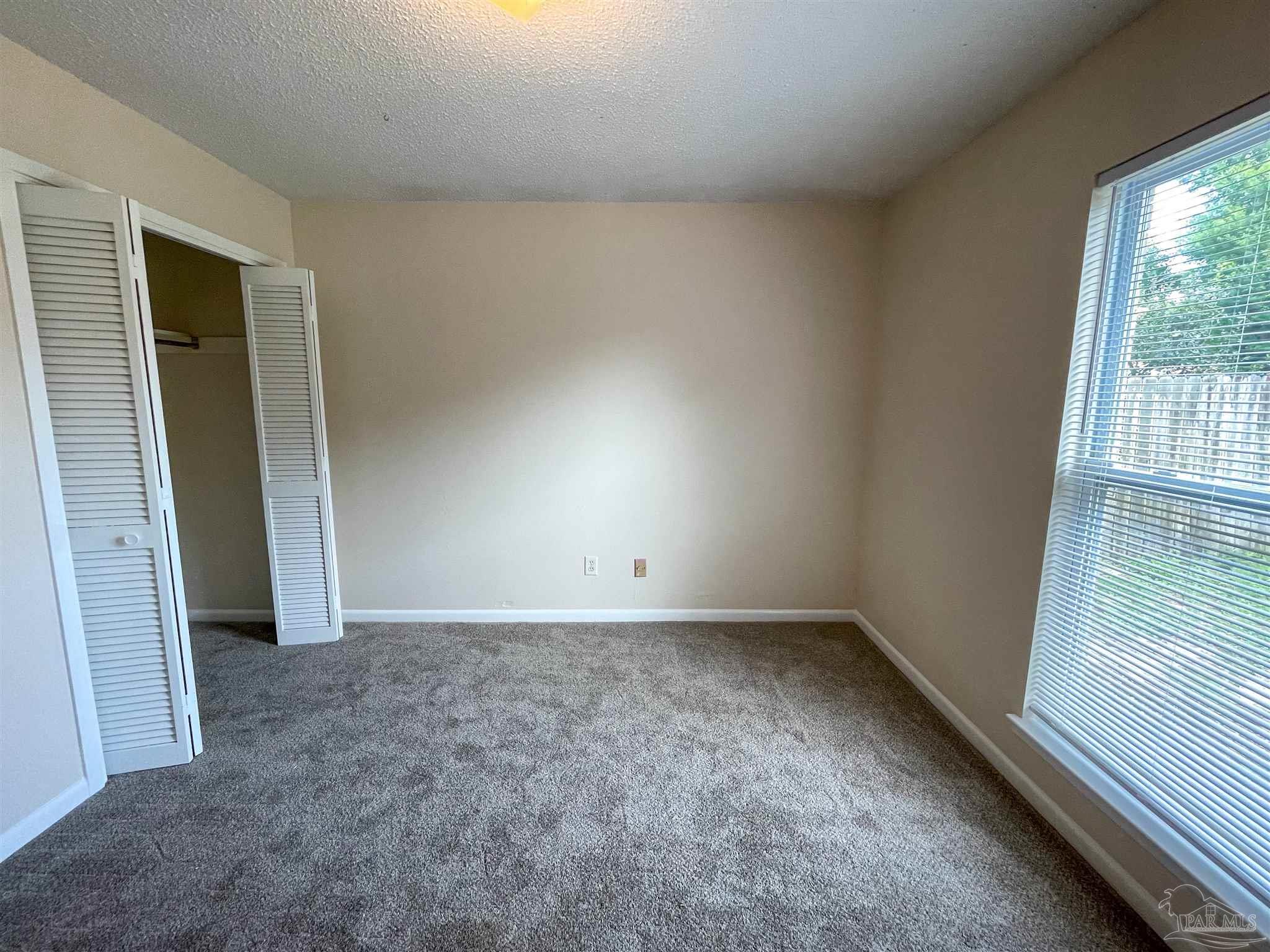 3226 Santa Rosa Drive Gulf Breeze, FL 32563 - Photo 10 of 11 an empty room with windows