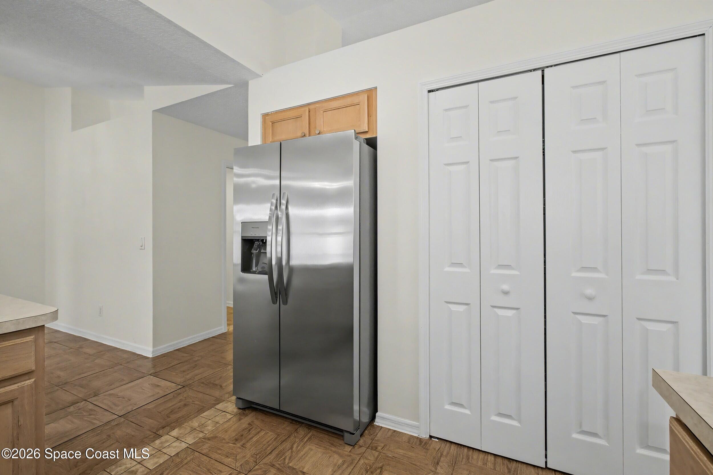 1175 Altamira Street Palm Bay, FL 32907 - Photo 16 of 37 a view of a refrigerator in kitchen counter space