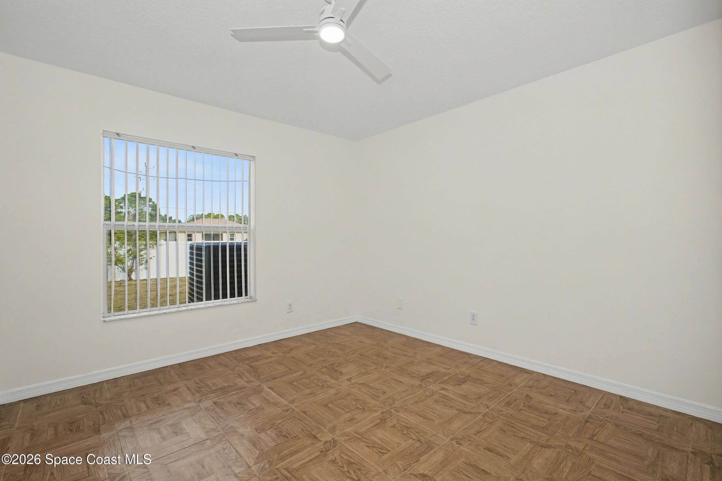 1175 Altamira Street Palm Bay, FL 32907 - Photo 26 of 37 an empty room with a window