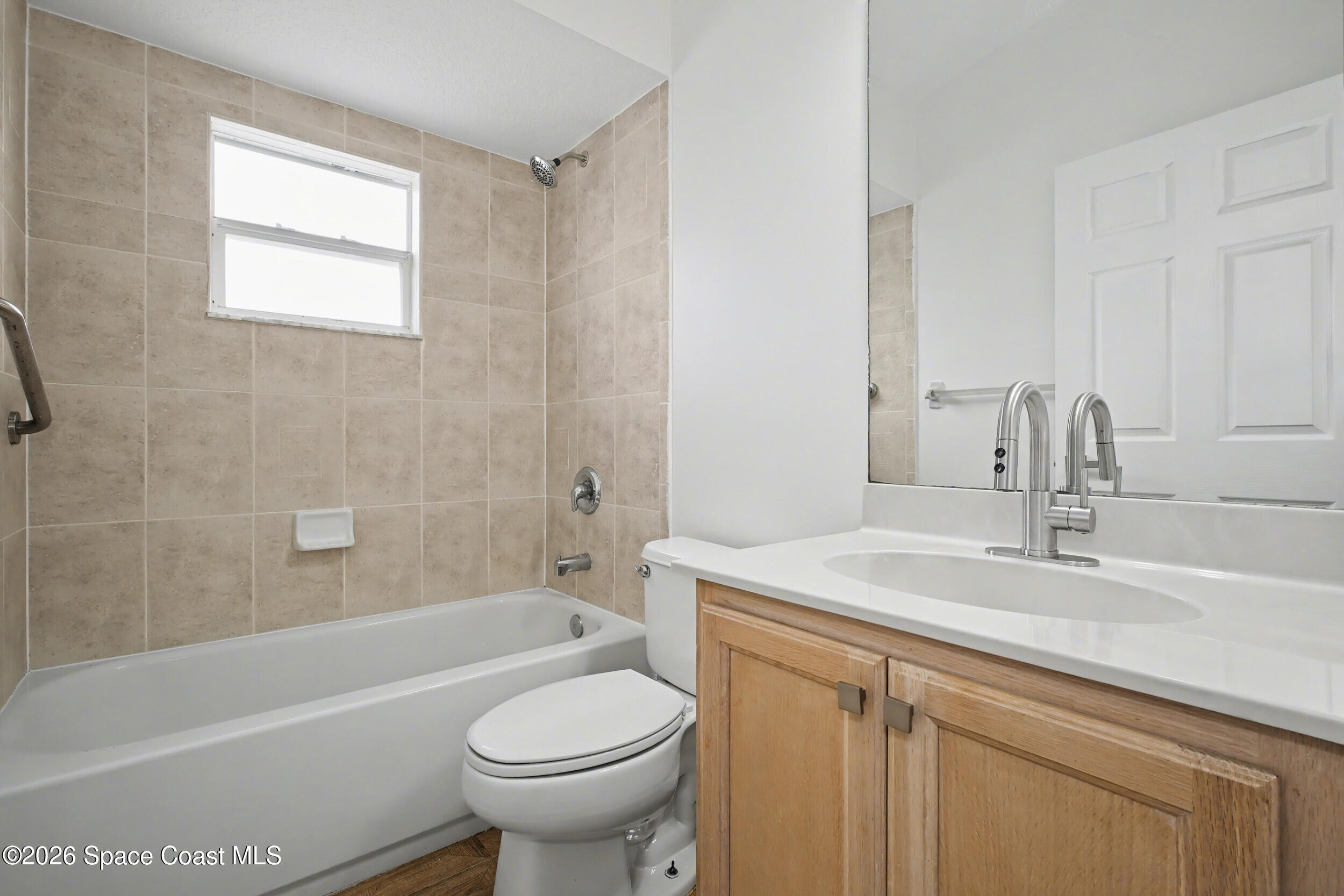1175 Altamira Street Palm Bay, FL 32907 - Photo 28 of 37 a bathroom with a sink toilet and bathtub