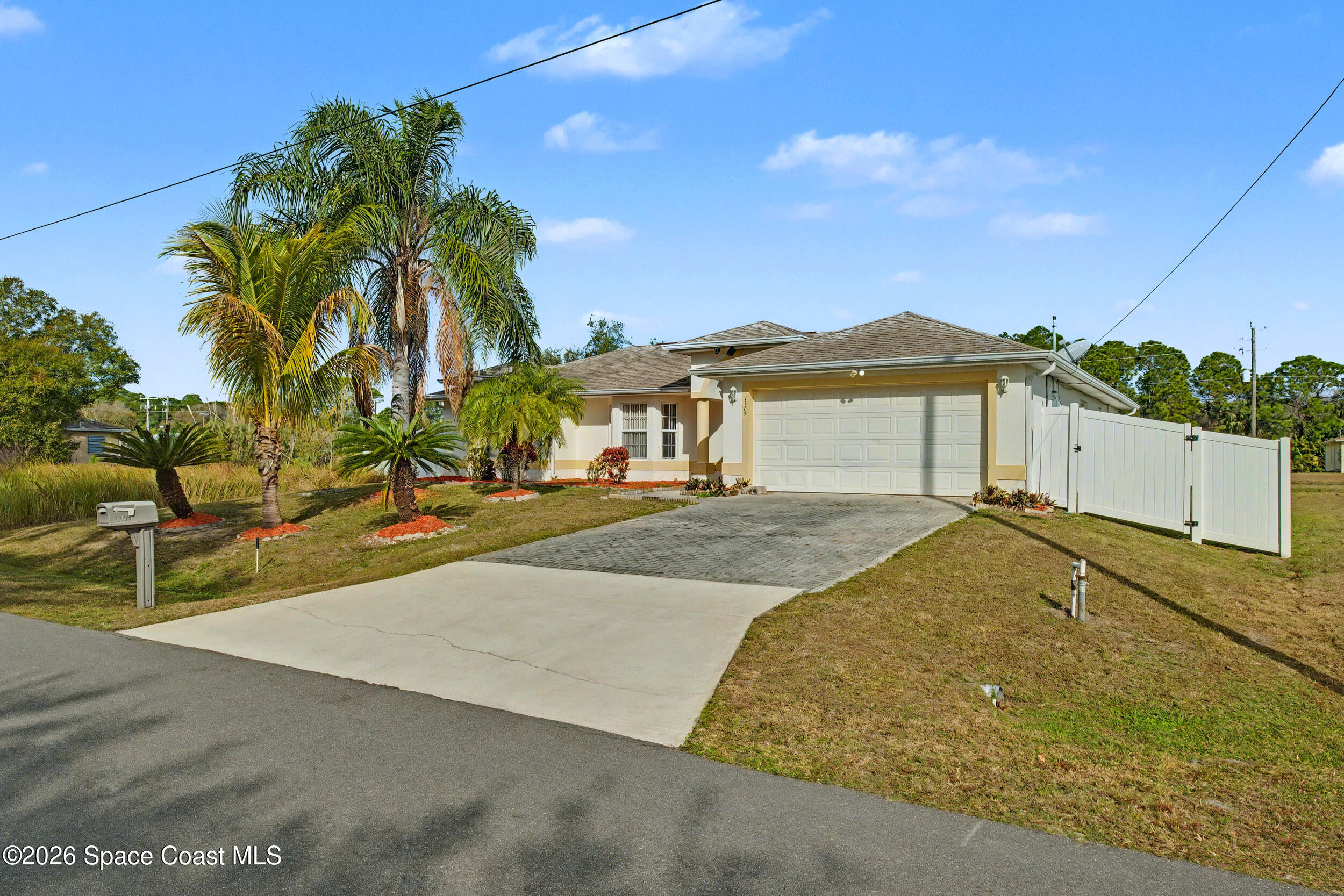1175 Altamira Street Palm Bay, FL 32907 - Photo 3 of 37 front view of a house with a yard