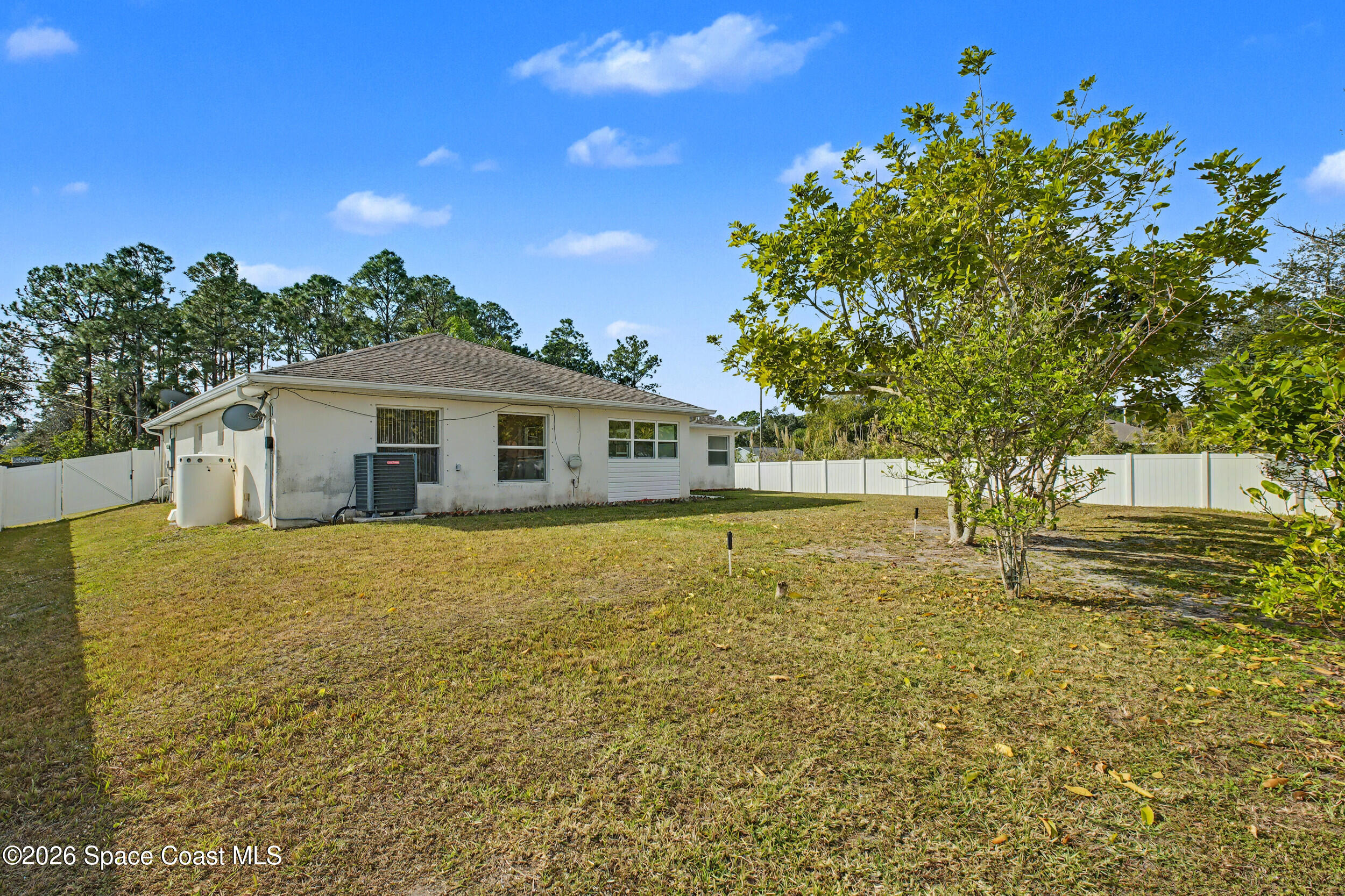 1175 Altamira Street Palm Bay, FL 32907 - Photo 35 of 37 a house view with swimming pool in front of it