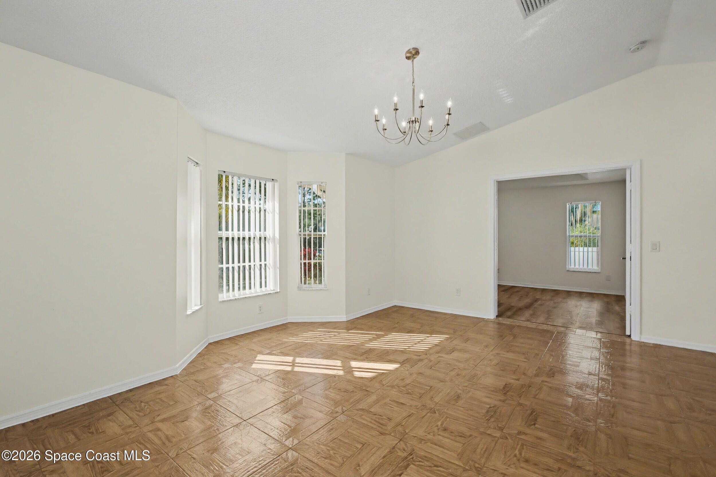 1175 Altamira Street Palm Bay, FL 32907 - Photo 5 of 37 a view of an empty room with a window