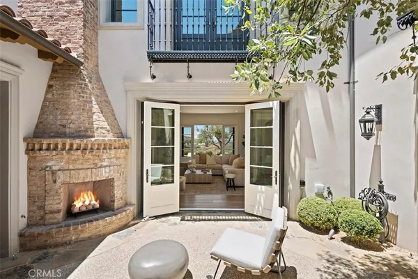 a front view of a house with outdoor seating