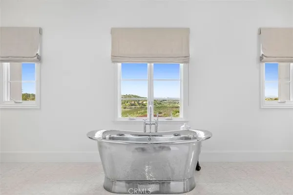 a white bath tub sitting in a bathroom