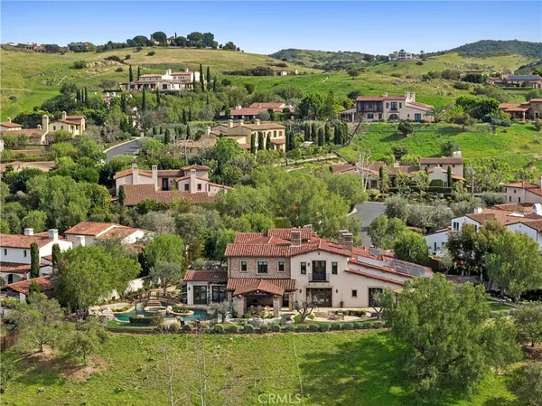 a view of a lake with houses in the back