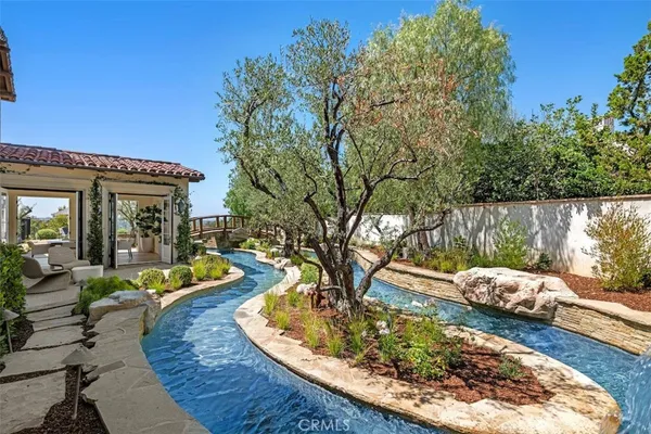 swimming pool with barbeque oven in front of it