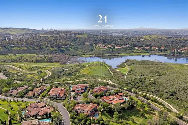 a view of a balcony with wooden floor and outdoor seating