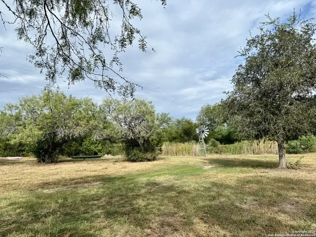 a view of outdoor space with trees all around