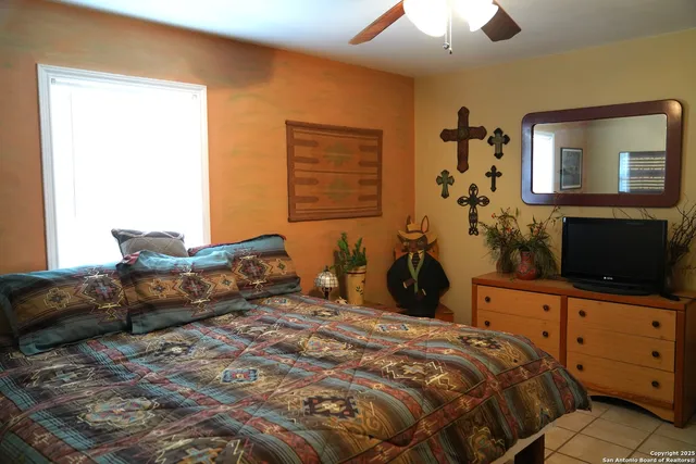 a bedroom with a bed and a dresser