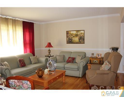 896 Inman Avenue Edison, NJ 08820 - Photo 2 of 14 a living room with furniture and a window