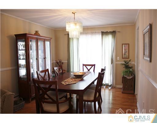 896 Inman Avenue Edison, NJ 08820 - Photo 3 of 14 a view of a dining room with furniture and wooden floor
