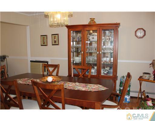 896 Inman Avenue Edison, NJ 08820 - Photo 4 of 14 a room with a table chairs and entryway