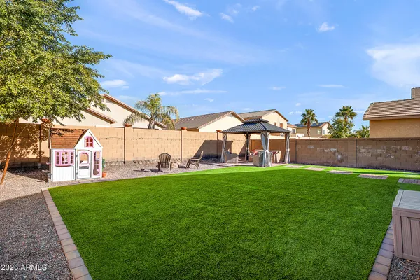 a view of yard with patio