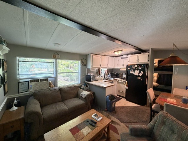 2795 East 28th Road Marseilles, IL 61341 - Photo 5 of 63 a living room with furniture a window and a flat screen tv