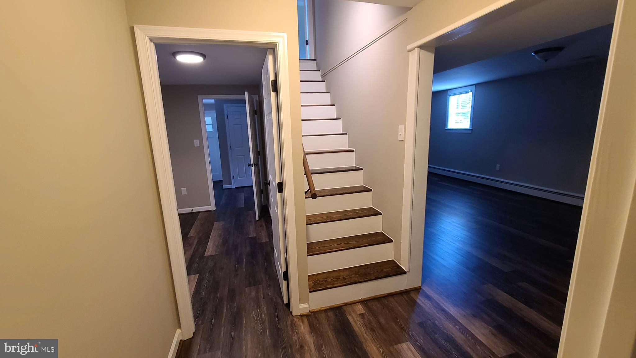 7 Cedar Drive Sterling, VA 20164 - Photo 11 of 40 a view of a hallway with wooden floor and stairs