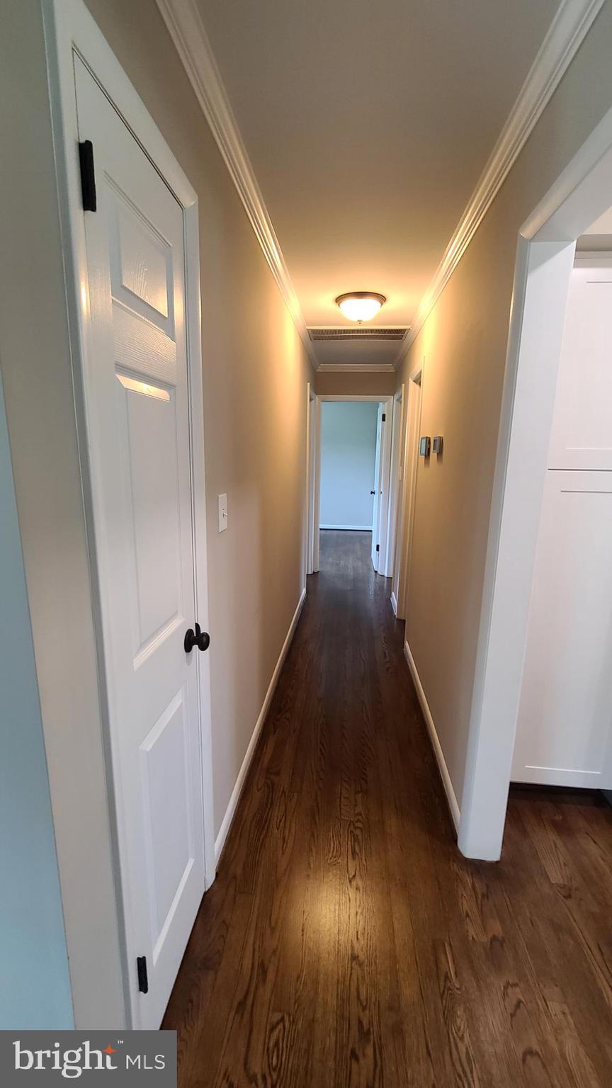 7 Cedar Drive Sterling, VA 20164 - Photo 15 of 40 a view of a hallway with wooden floor