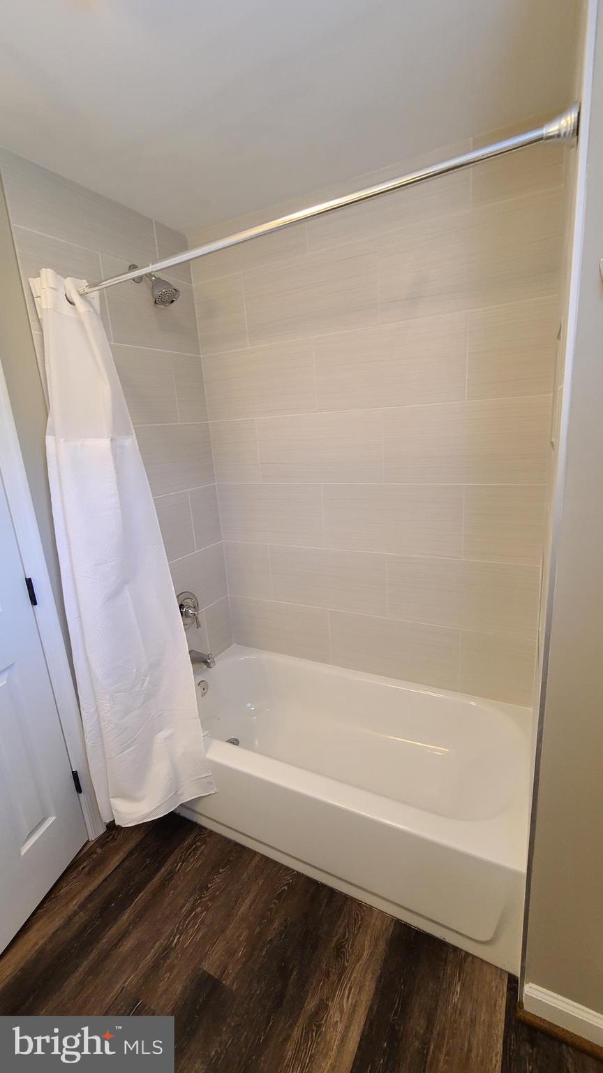 7 Cedar Drive Sterling, VA 20164 - Photo 16 of 40 a bathroom with a shower and a bath tub