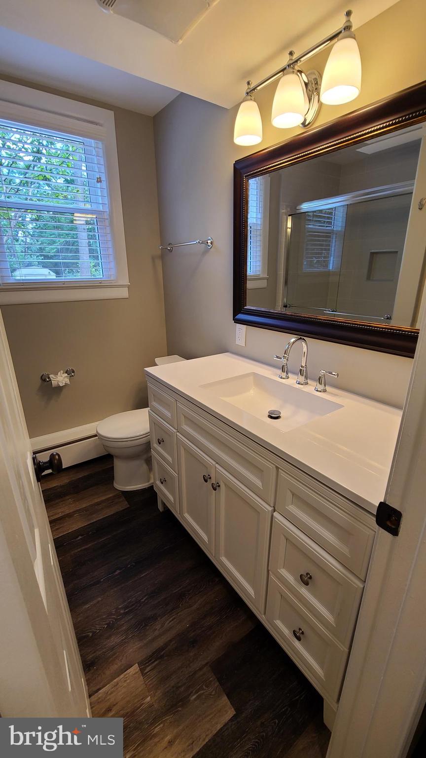 7 Cedar Drive Sterling, VA 20164 - Photo 25 of 40 a bathroom with a toilet sink and mirror