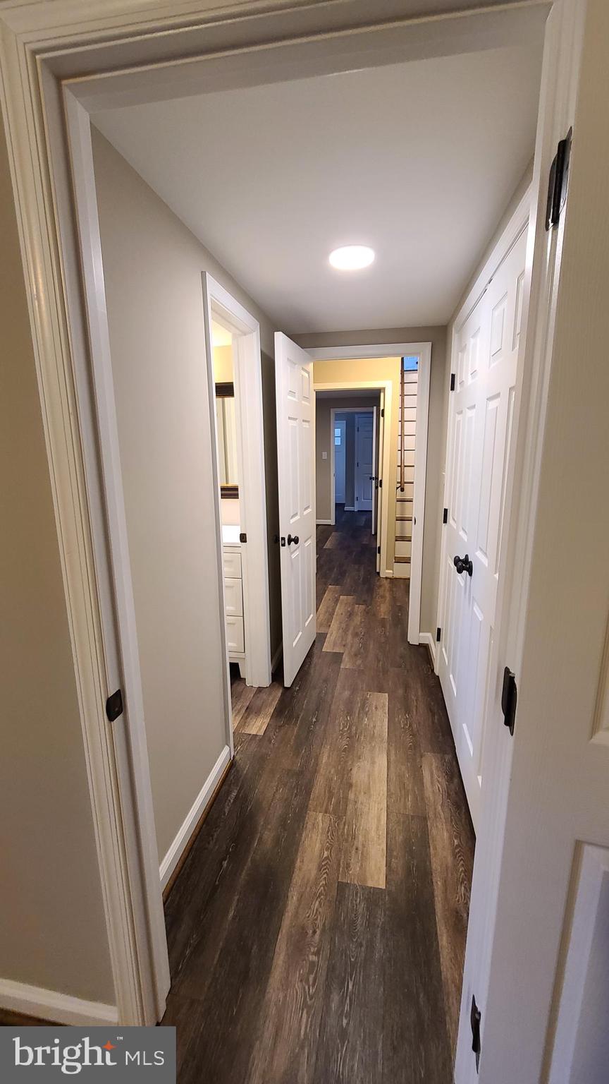 7 Cedar Drive Sterling, VA 20164 - Photo 26 of 40 a view of a hallway with wooden floor and staircase
