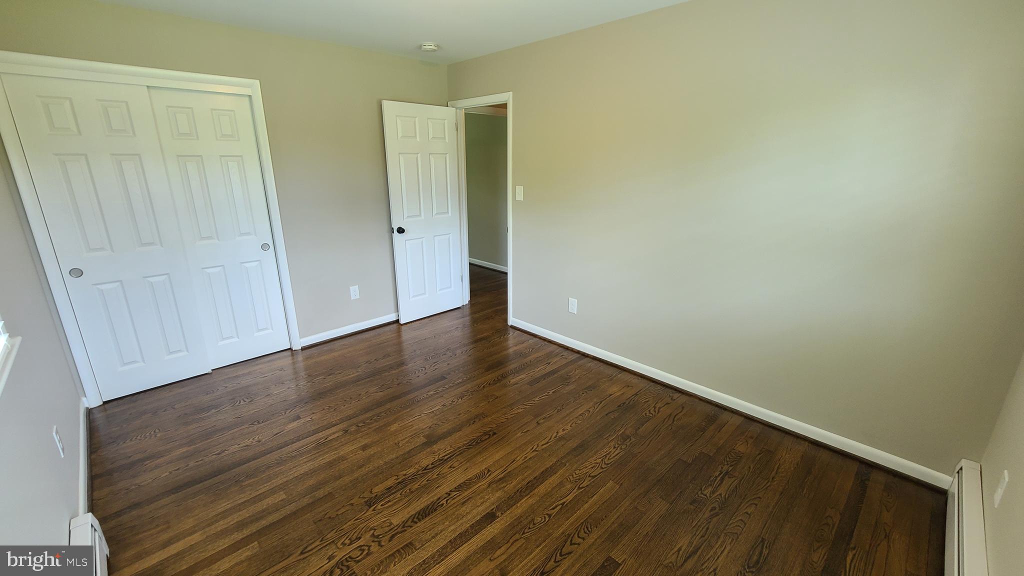 7 Cedar Drive Sterling, VA 20164 - Photo 28 of 40 a view of an empty room with wooden floor