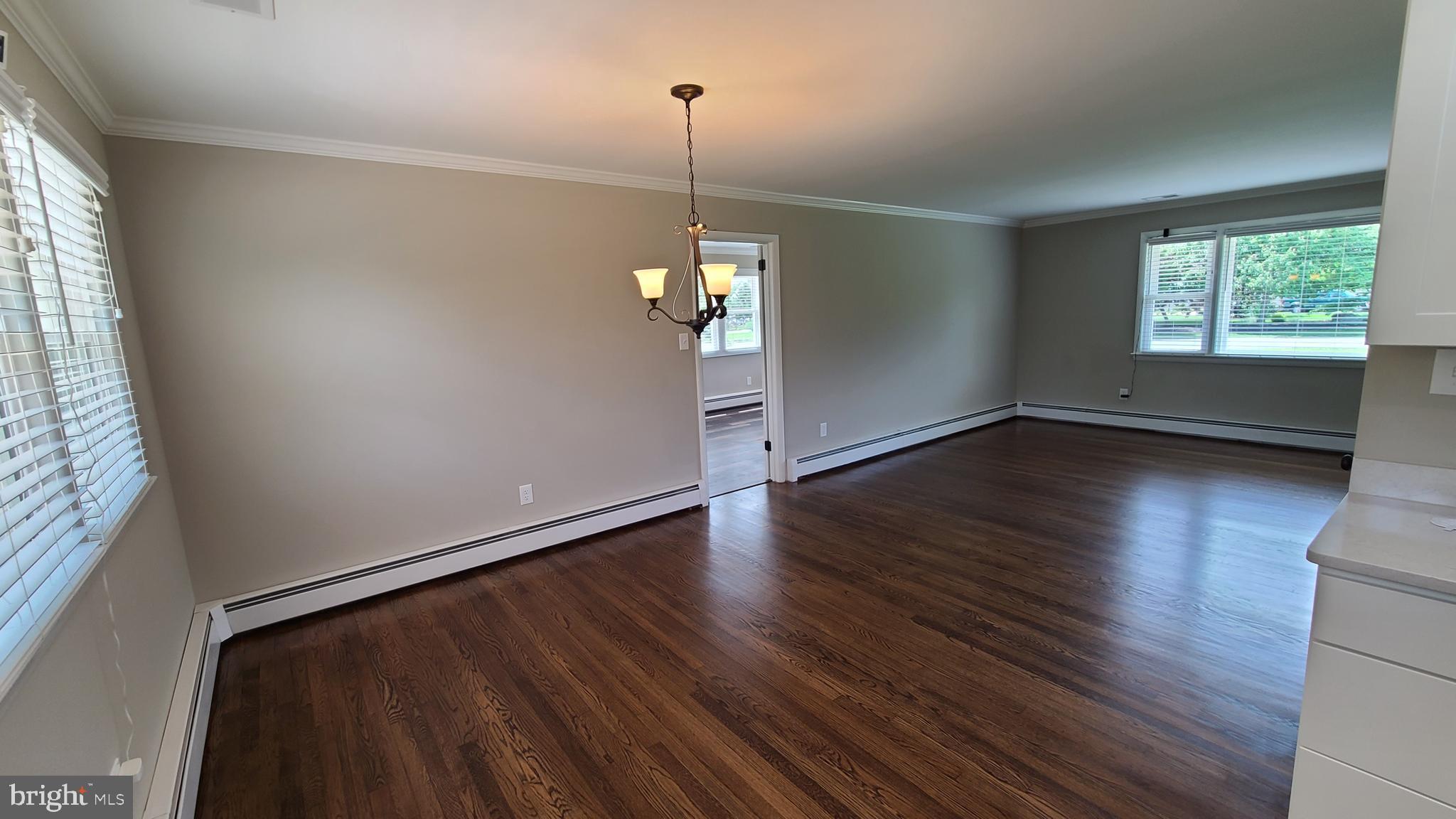 7 Cedar Drive Sterling, VA 20164 - Photo 5 of 40 an empty room with wooden floor and windows