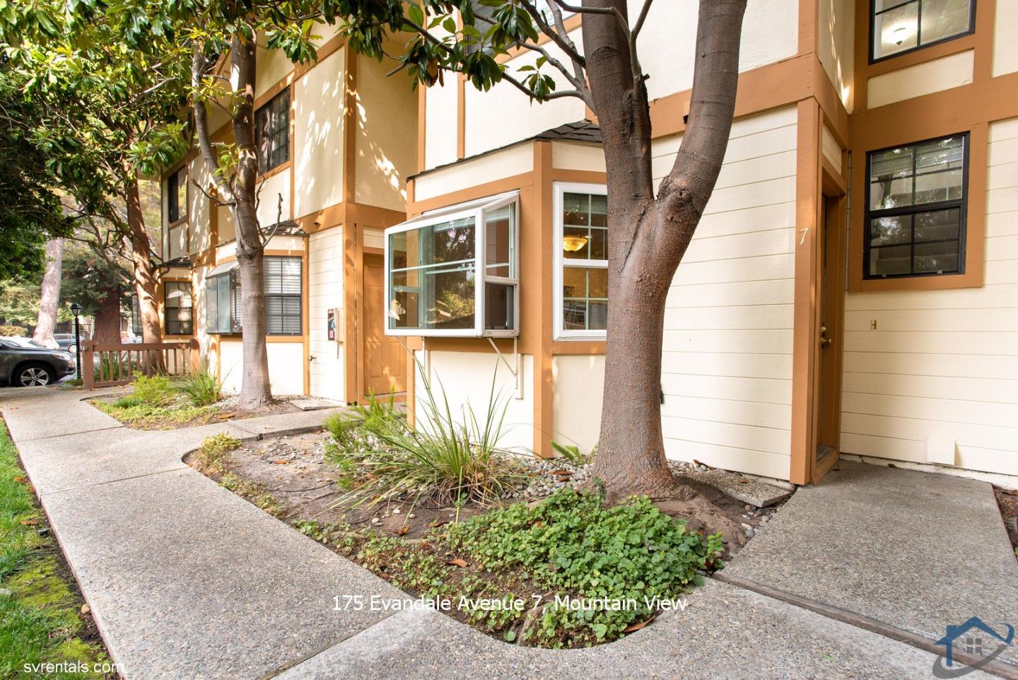175 Evandale Avenue, Unit 7 Mountain View, CA 94043 - Photo 1 of 20 a front view of a house with garden