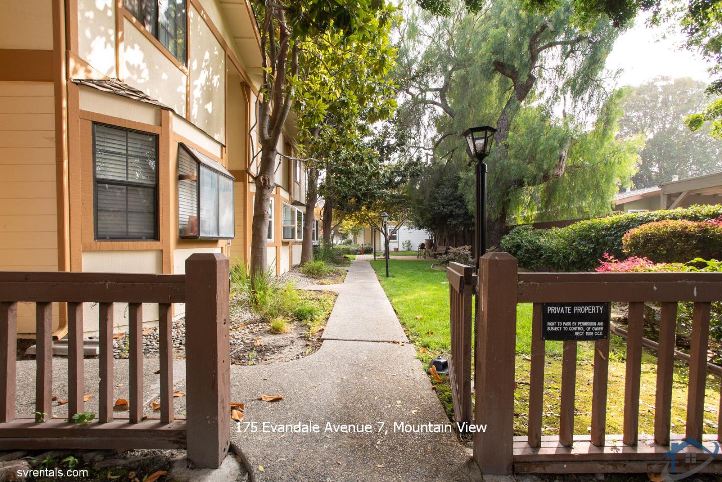 175 Evandale Avenue, Unit 7 Mountain View, CA 94043 - Photo 2 of 20 a view of a brick house with a small yard