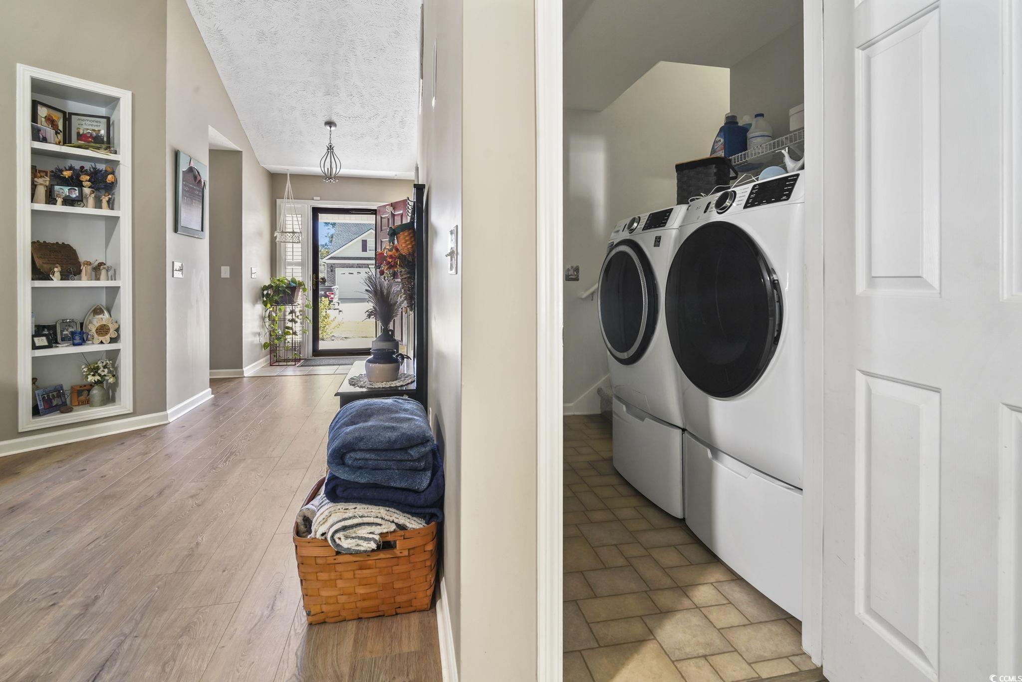 4105 Eva Bay Drive Murrells Inlet, SC 29576 - Photo 20 of 40 Washroom featuring a textured ceiling, light wood-style floors, built in features, and independent washer and dryer