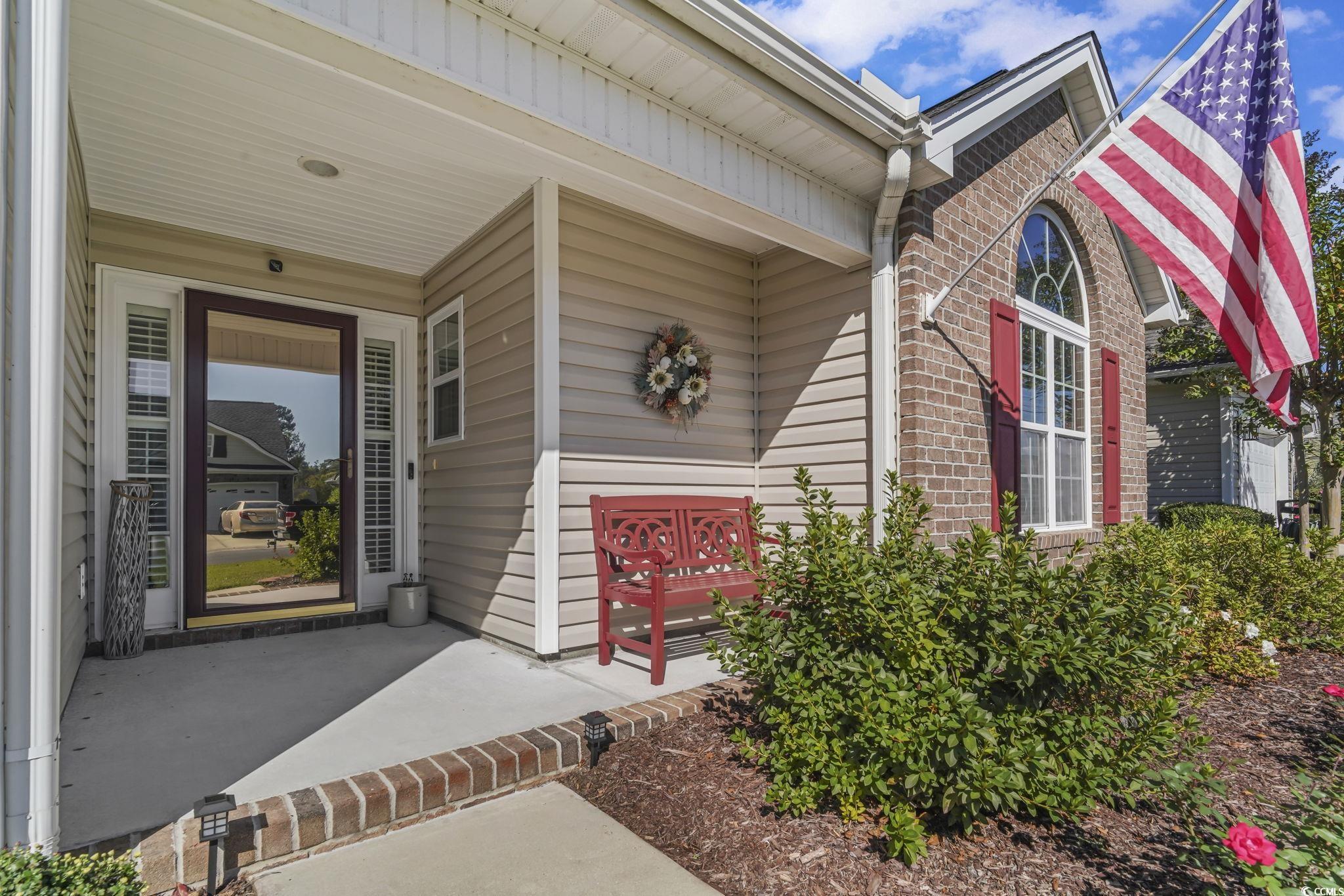 4105 Eva Bay Drive Murrells Inlet, SC 29576 - Photo 2 of 40 Entrance to property featuring brick siding and a porch