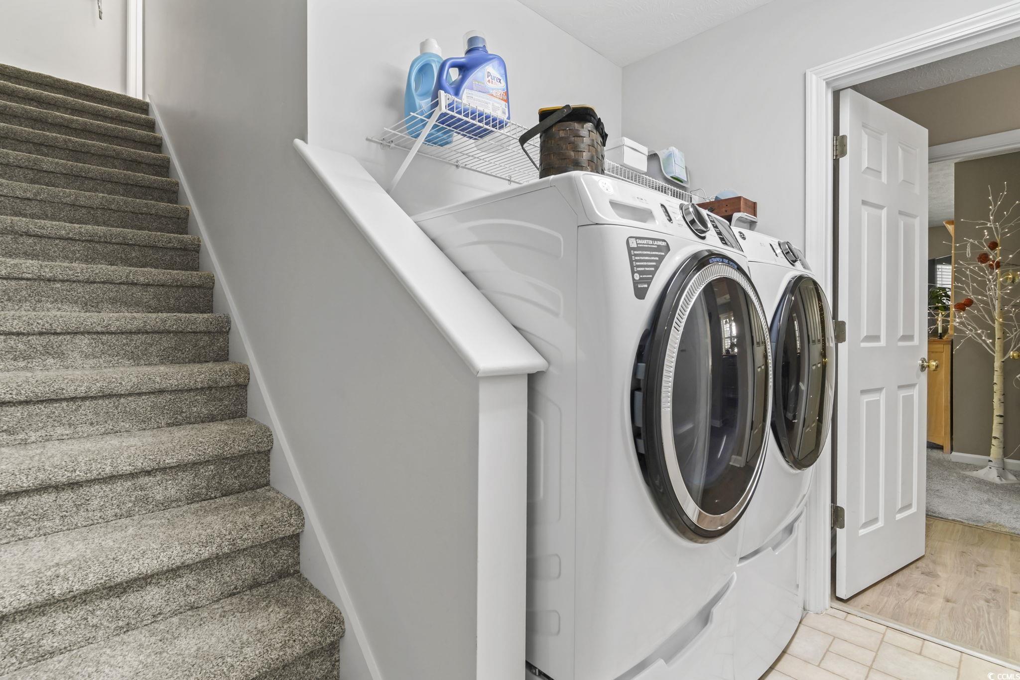 4105 Eva Bay Drive Murrells Inlet, SC 29576 - Photo 21 of 40 Laundry area featuring independent washer and dryer and wood finished floors