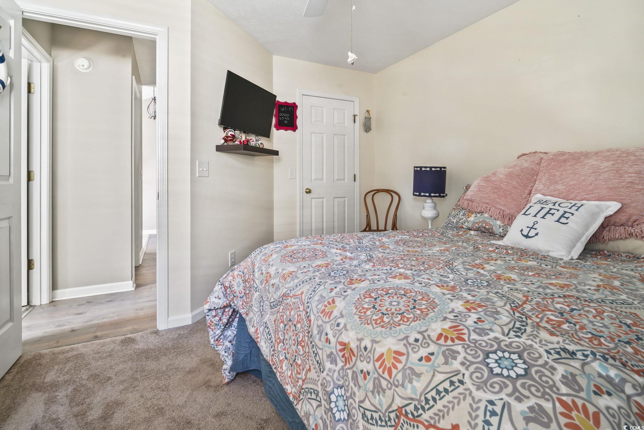 4105 Eva Bay Drive Murrells Inlet, SC 29576 - Photo 28 of 40 Bedroom featuring light carpet and a ceiling fan