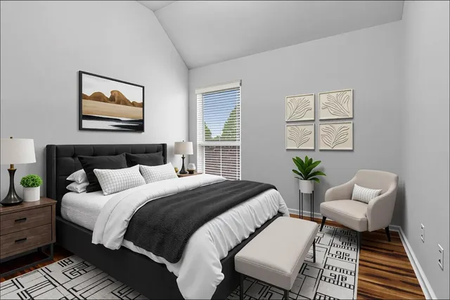 a bedroom with bed and a window