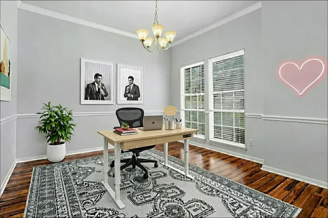a workspace with furniture and a potted plant
