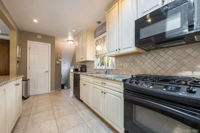 a bathroom with a sink mirror and toilet