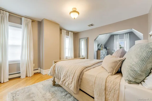 a bed room with a bed and a window