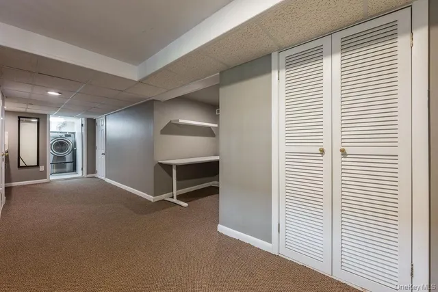 a utility room with sink dryer and washer